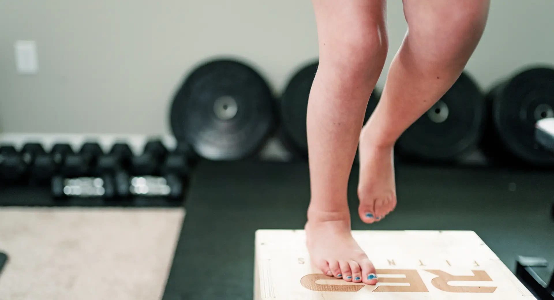 Kid jumping on box during training