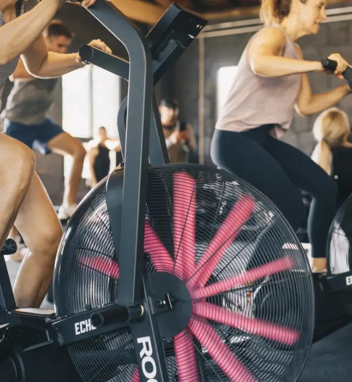 Members working out on bikes together